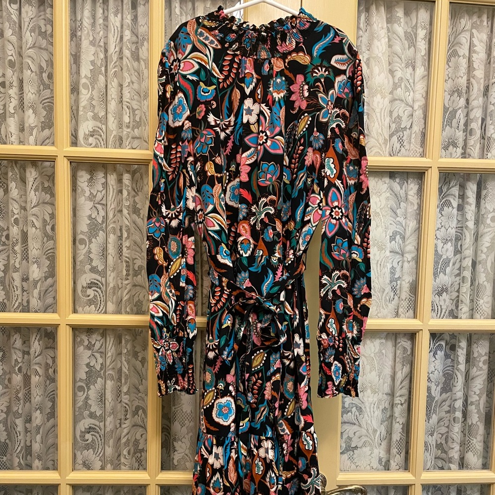 Boden size 8. Fun flouiiral dress with smocking at neck and cuffs.